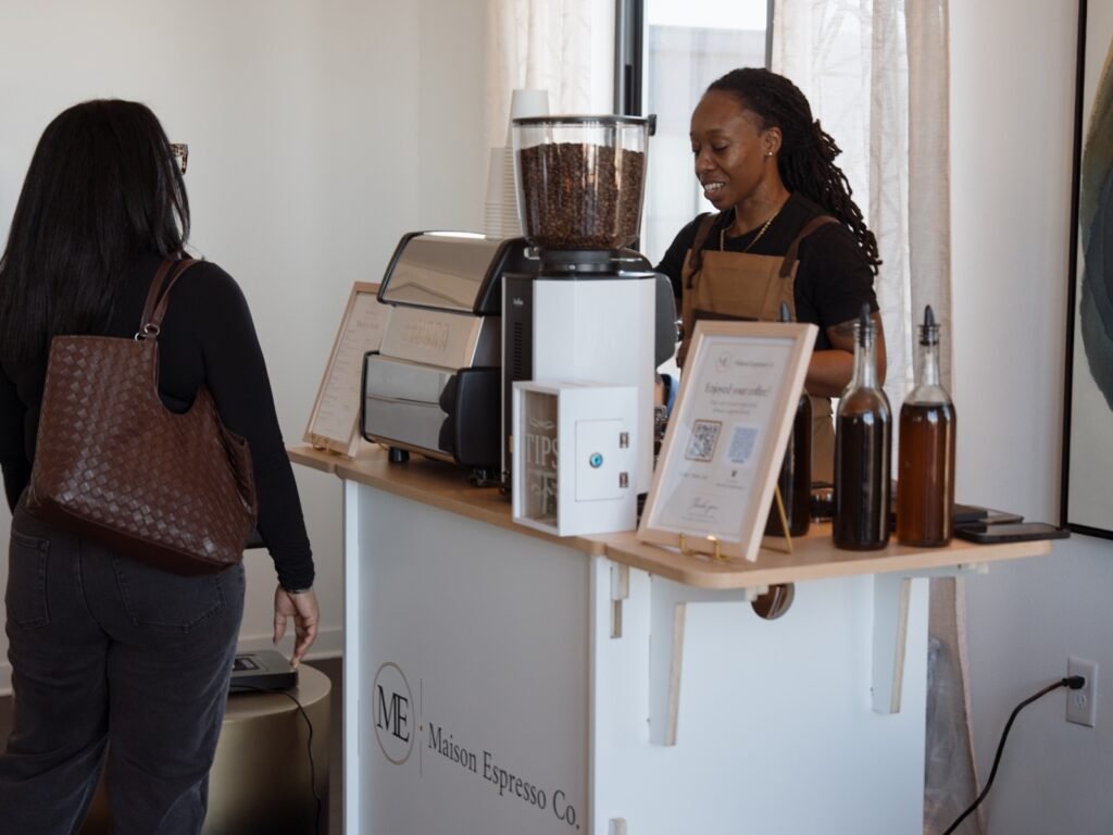 Founder Keyanna Mayfield serving a guest at the Maison Espresso Co. mobile coffee cart